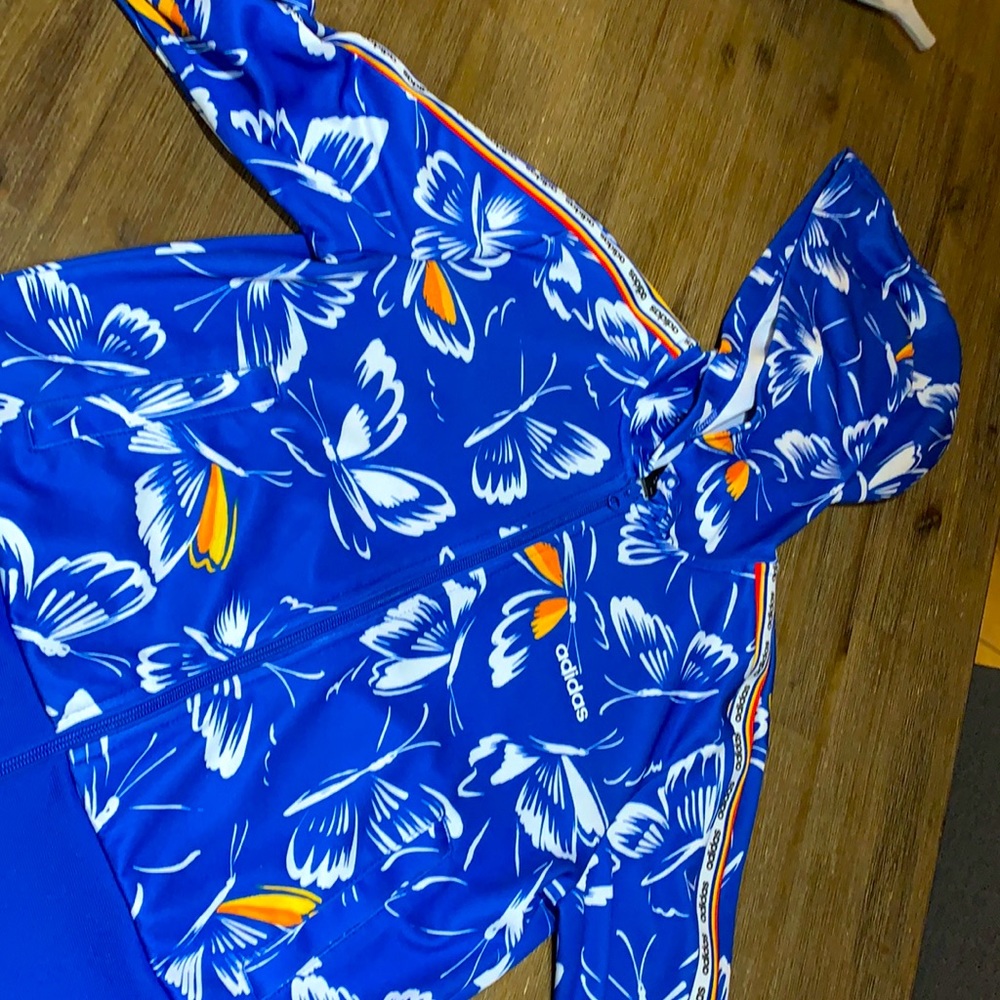 Adidas zip up it’s blue with white, orange and a bit of yellow